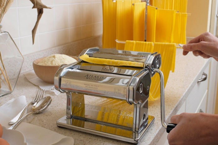 Person using a Marcato Atlas Pasta Machine to make pasta.